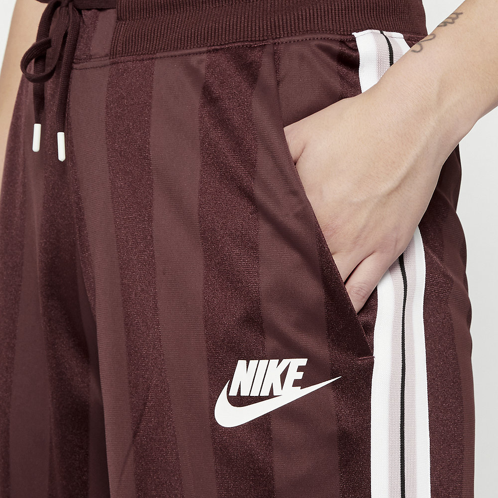 NIKE NSW Pant OH SHDW STRP el dorado/antique silver/white