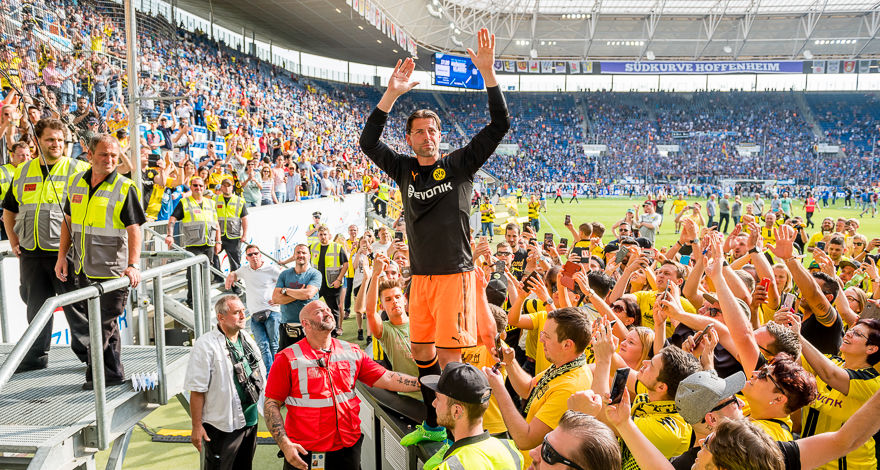 SINSHEIM, GERMANY - MAY 12: Goal keeper Roman Weidenfeller of Borussia Dortmund together with the fans after his last match for the club after the final whistle the Bundesliga match between TSG 1899 Hoffenheim and Borussia Dortmund at the Wirsol Rhein-Neckar-Arena on May 12, 2018 in Sinsheim, Germany.  (Photo by Alexandre Simoes/Borussia Dortmund/Getty Images)