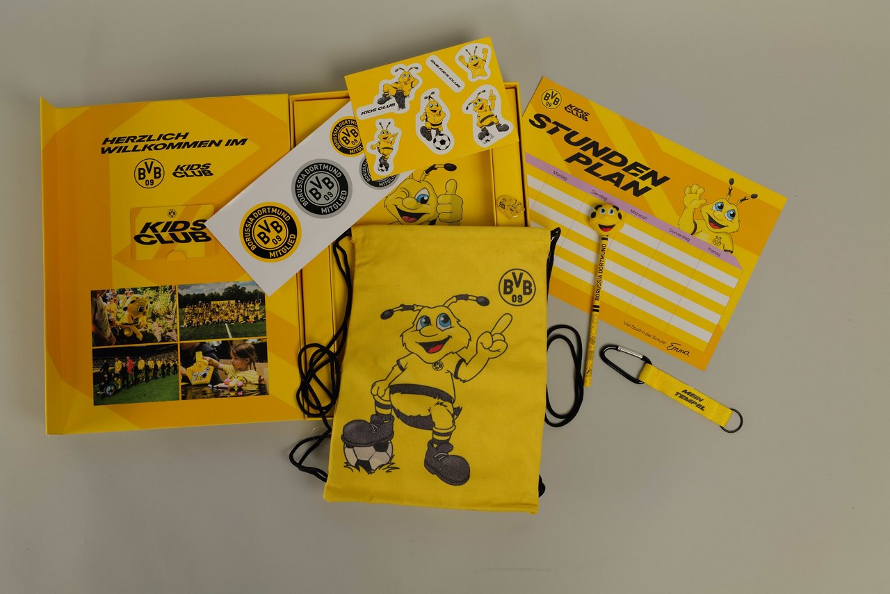 Welcome package for joining the KidsClub (including gym bag, writing utensils, keychain, membership card, and certificate).