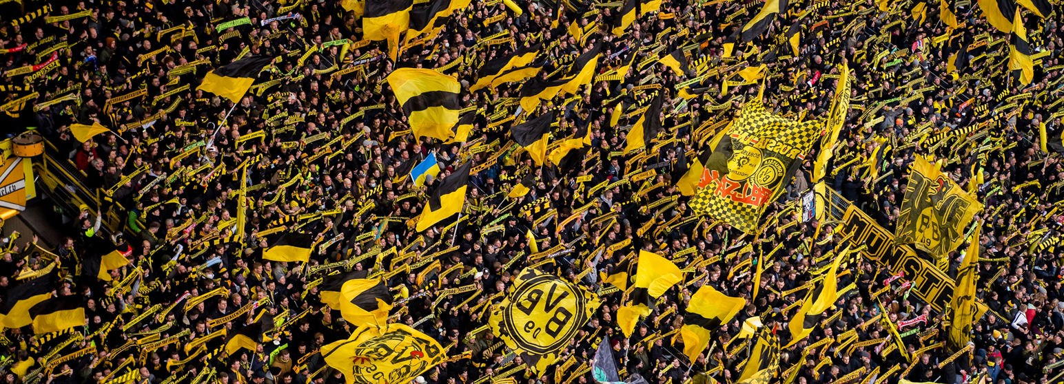 Fans with scarves on Signal Iduna Park South Stand