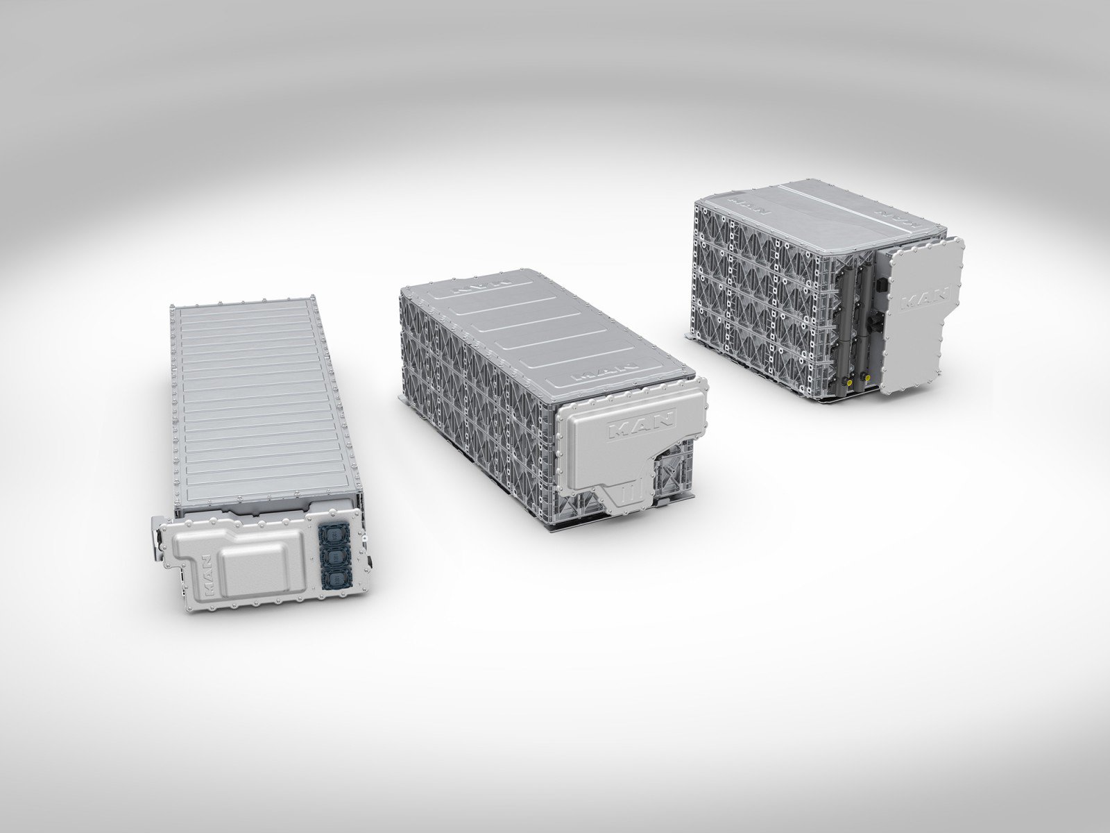 Three MAN high-voltage battery modules on white background