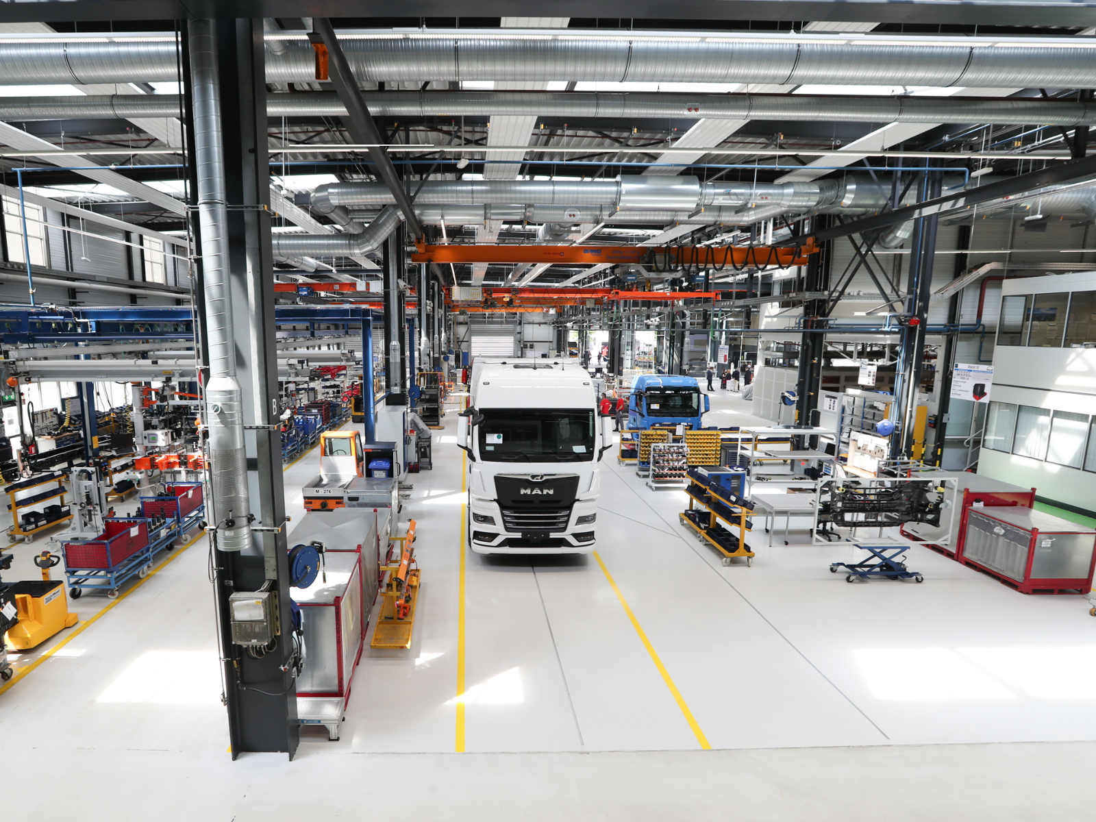 MAN eTruck in production hall with assembly lines and equipment