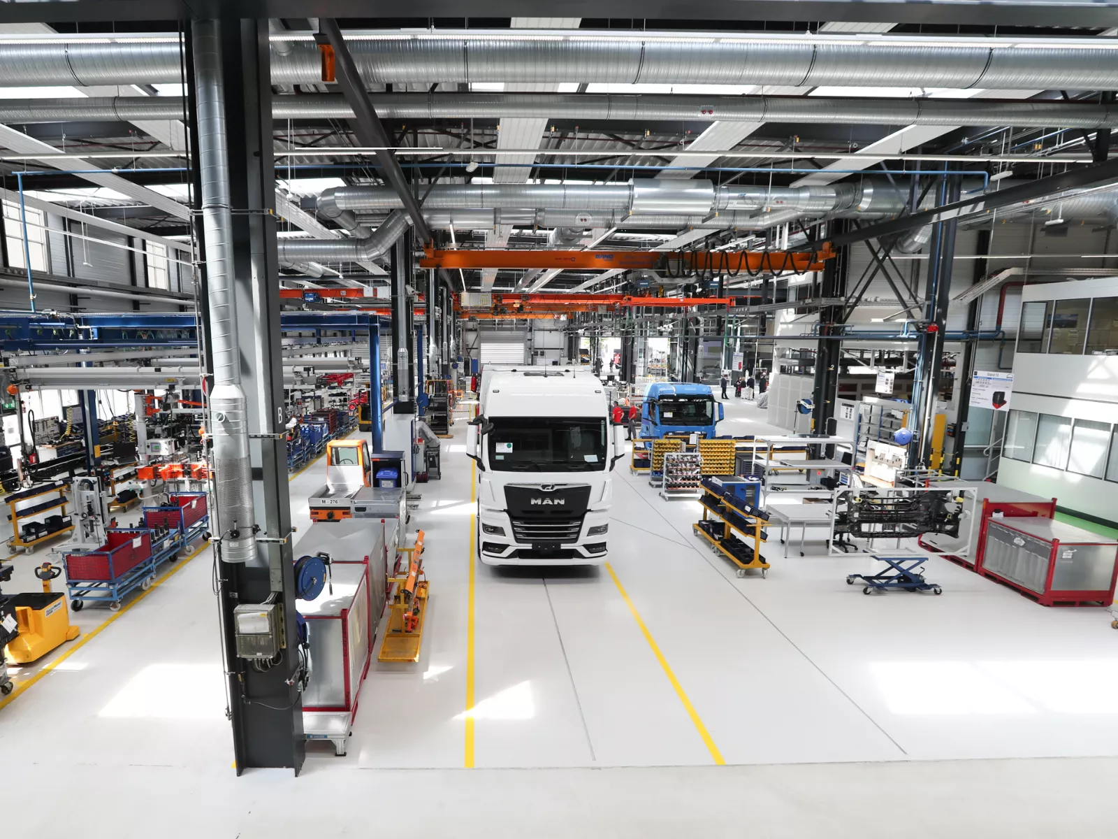 MAN eTruck in production hall with assembly lines and equipment
