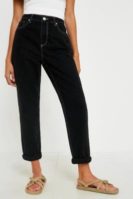 black mom jeans with white stitching