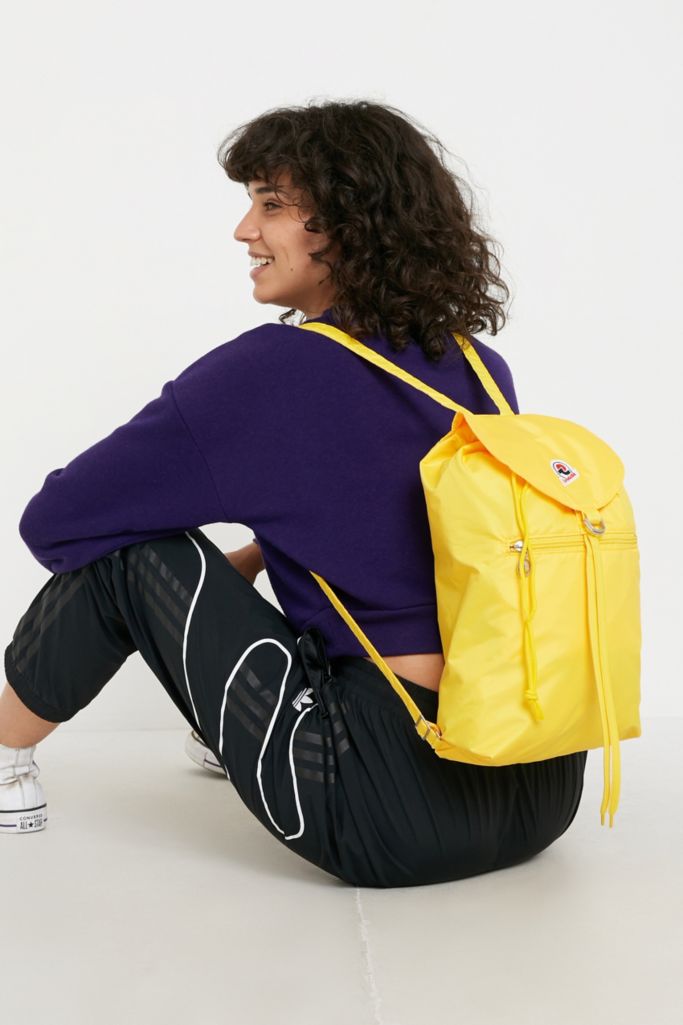 Invicta Minisac Yellow Glossy Backpack | Urban Outfitters UK