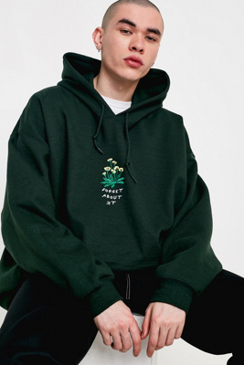 green hooded jumper