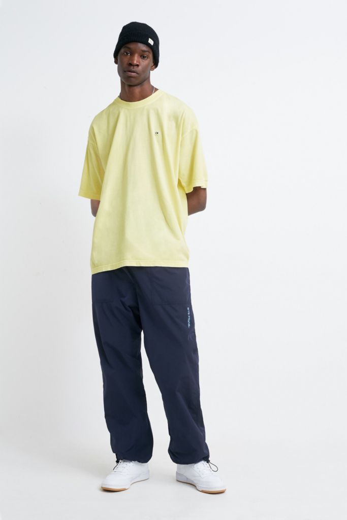 Calvin Klein Badge Logo Yellow Relaxed T-Shirt | Urban Outfitters UK