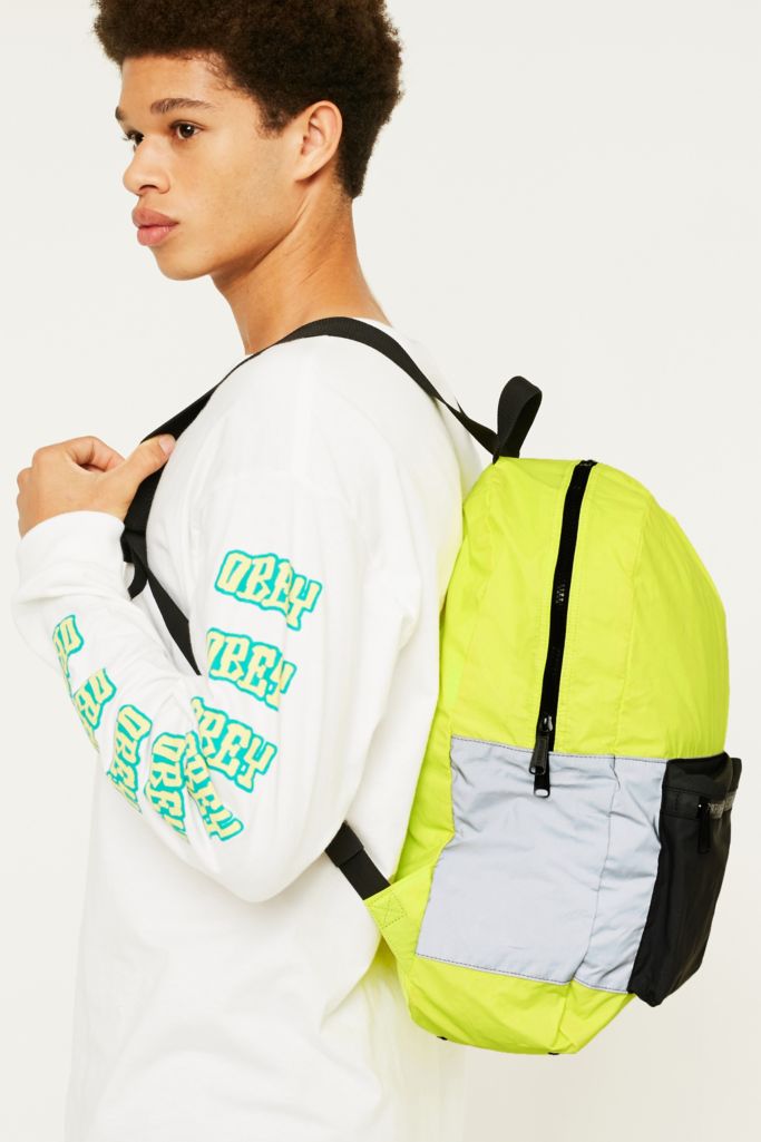 Herschel Supply Co. Neon Reflective Packable Daypack | Urban Outfitters UK