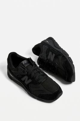 all black new balance trainers