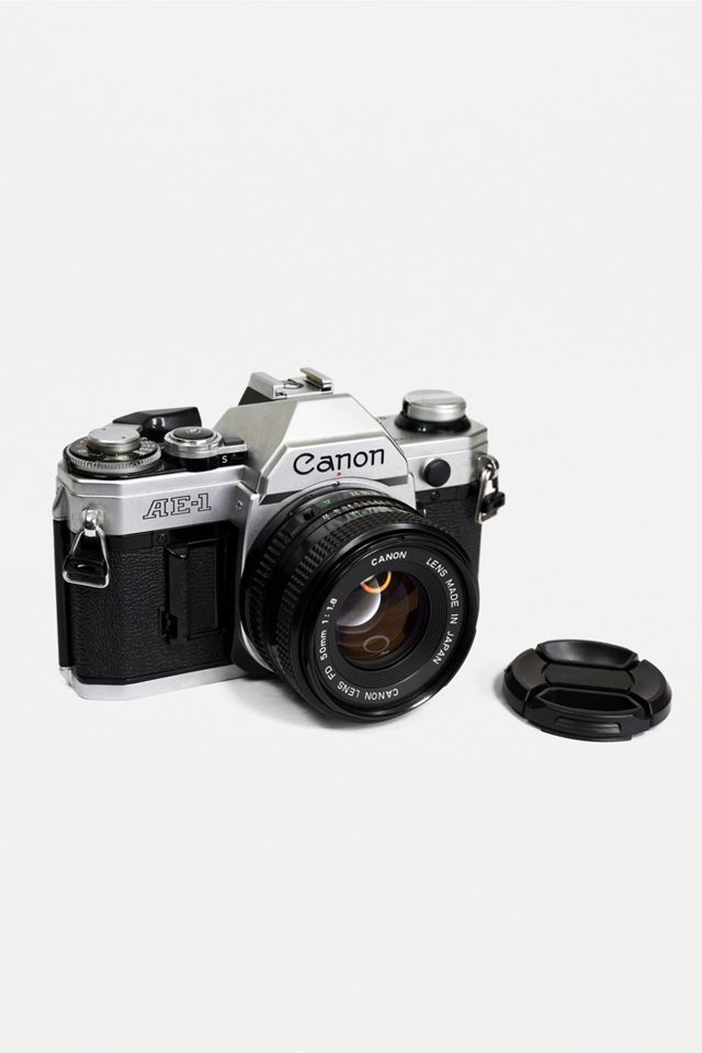 Vintage Camera Hut Canon Ae 1 35mm Film Camera With Canon Fd 50mm F 1 8 Prime Lens Urban Outfitters Uk