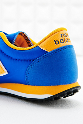 new balance blue yellow 410 trainers