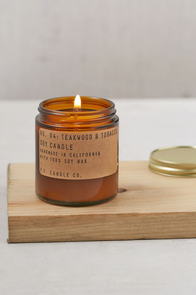 P.F. Candle Co. Teakwood & Tobacco Travel Jar Candle | Urban Outfitters UK