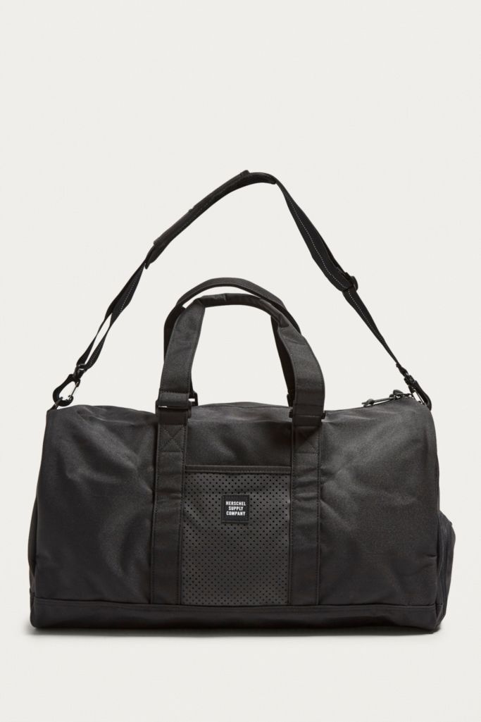 Herschel Supply Co. Novel Black Weekender Holdall Bag | Urban Outfitters UK