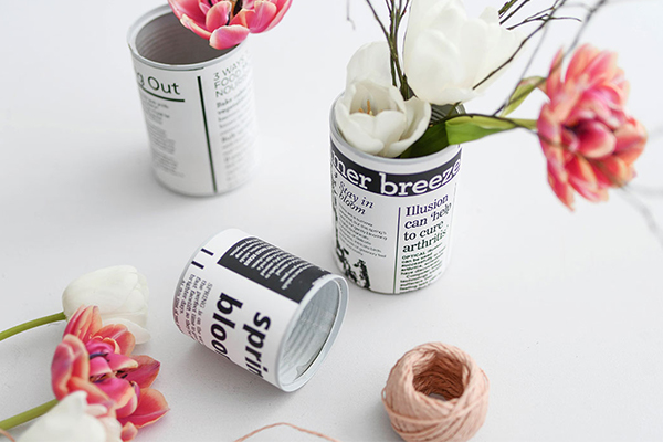 Dosen mit Papier beklebt