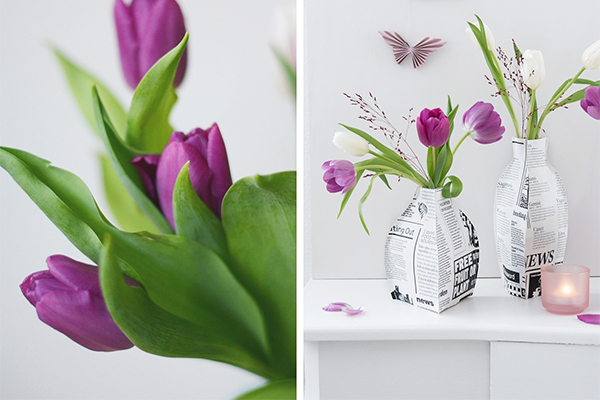 Lila Tulpen in einer Zeitungspapiervase