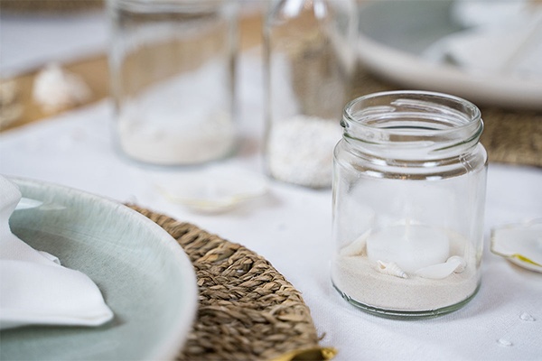 Windlichter mit Sand und Muscheln