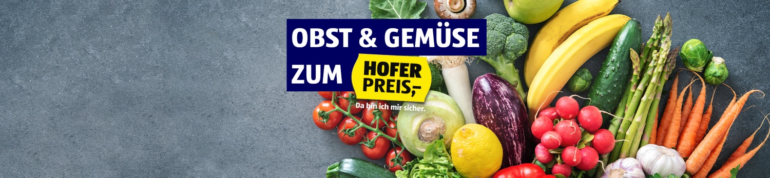 Verschiedene Sorten Gemüse liegen auf einem grauen Hintergrund.