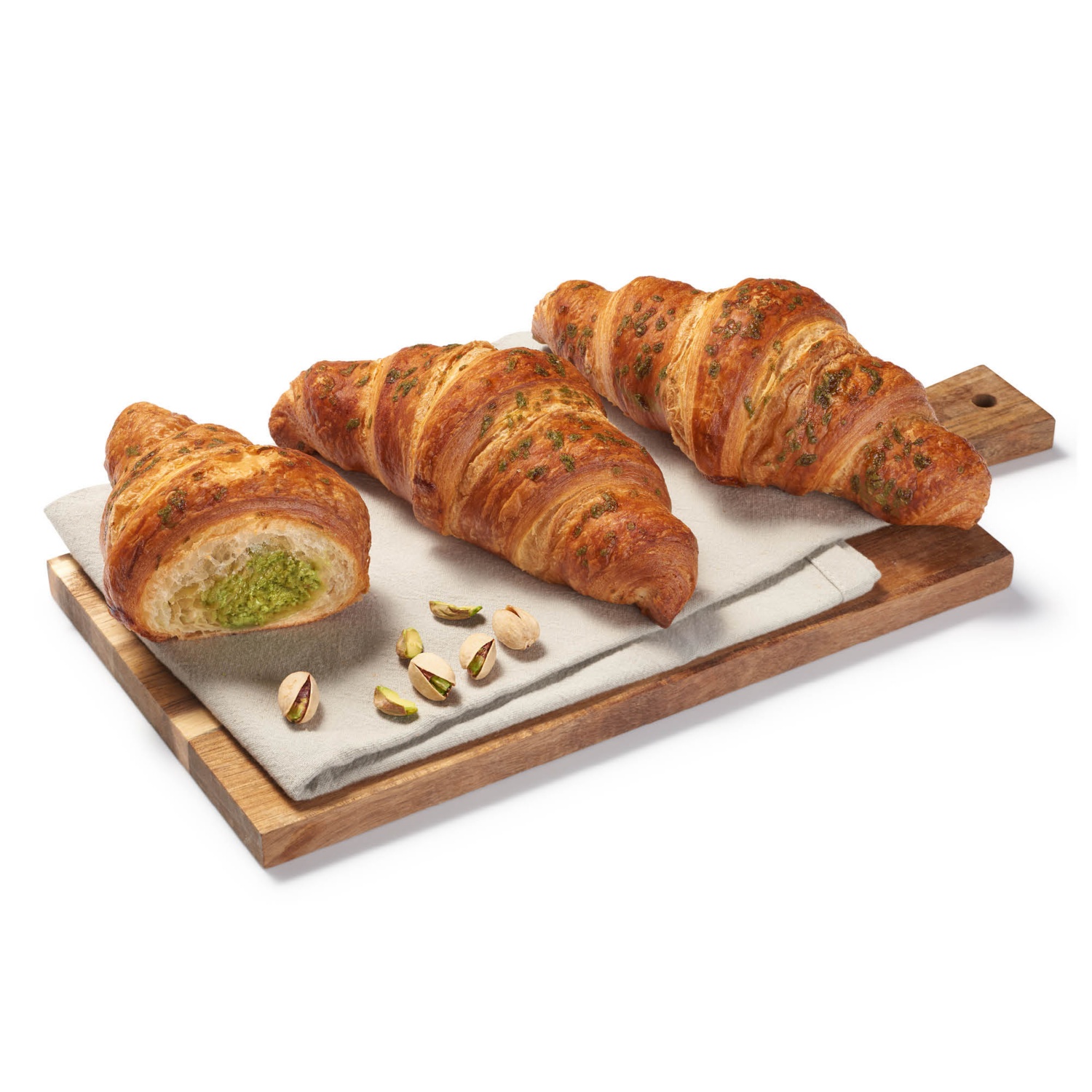 AZON MELEGÉBEN Croissant pisztáciás krémmel töltve és zöld cukordekorációval díszítve, 95 g