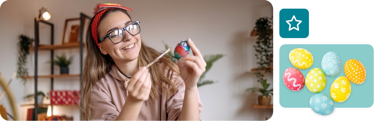 Eine Frau bemalt ein Osterei von Hand mit einem Pinsel.