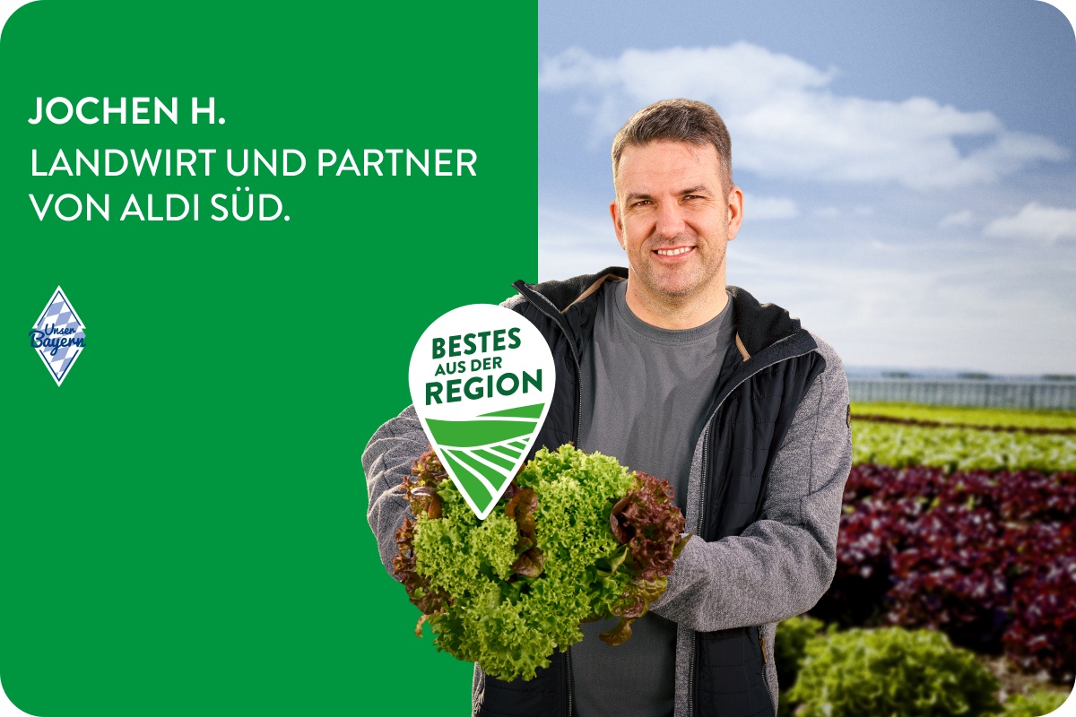 Landwirt mit Salaten.