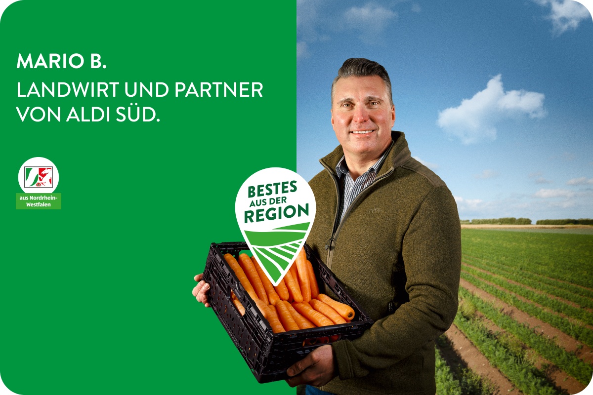 Landwirt mit Korb voller Möhren.