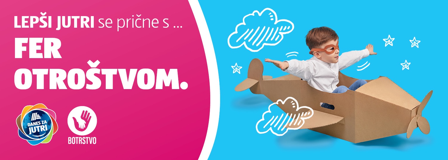 Deček z letalskimi očali v kartonskem letalu