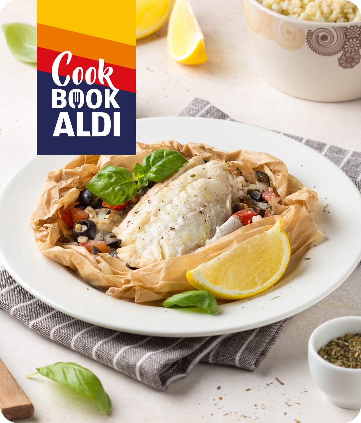 Filetti di branzino al cartoccio con patate, limone e olive