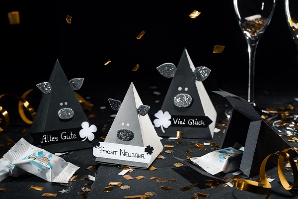 Schweinchen mit Süßigkeiten gefllt und mit Konfetti verziert 