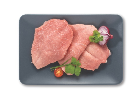 Svinjski zrezki na sivem krožniku