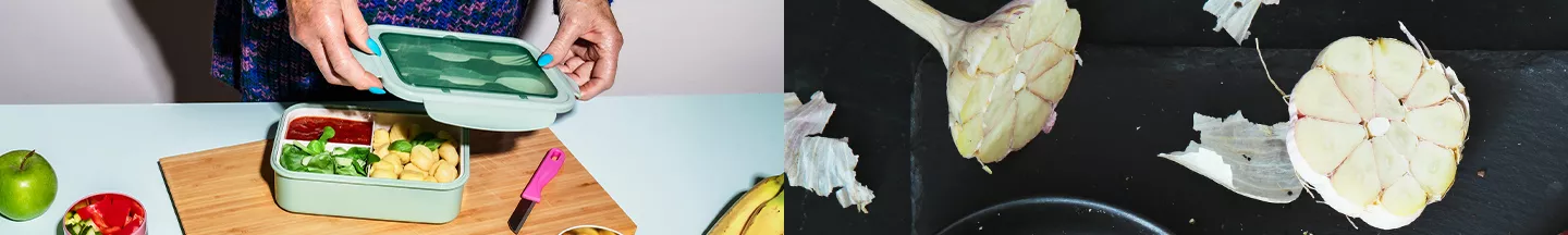 Person macht Meal Prep und Bund Knoblauch der in der Mitte durchgeschnitten ist.