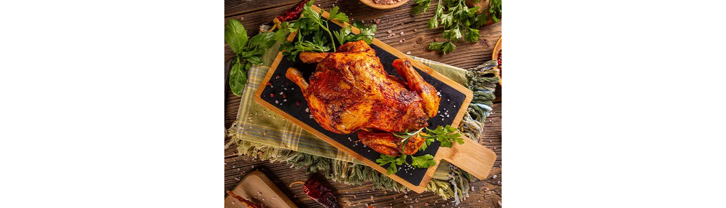 Presentación de pollo entero asado al horno
