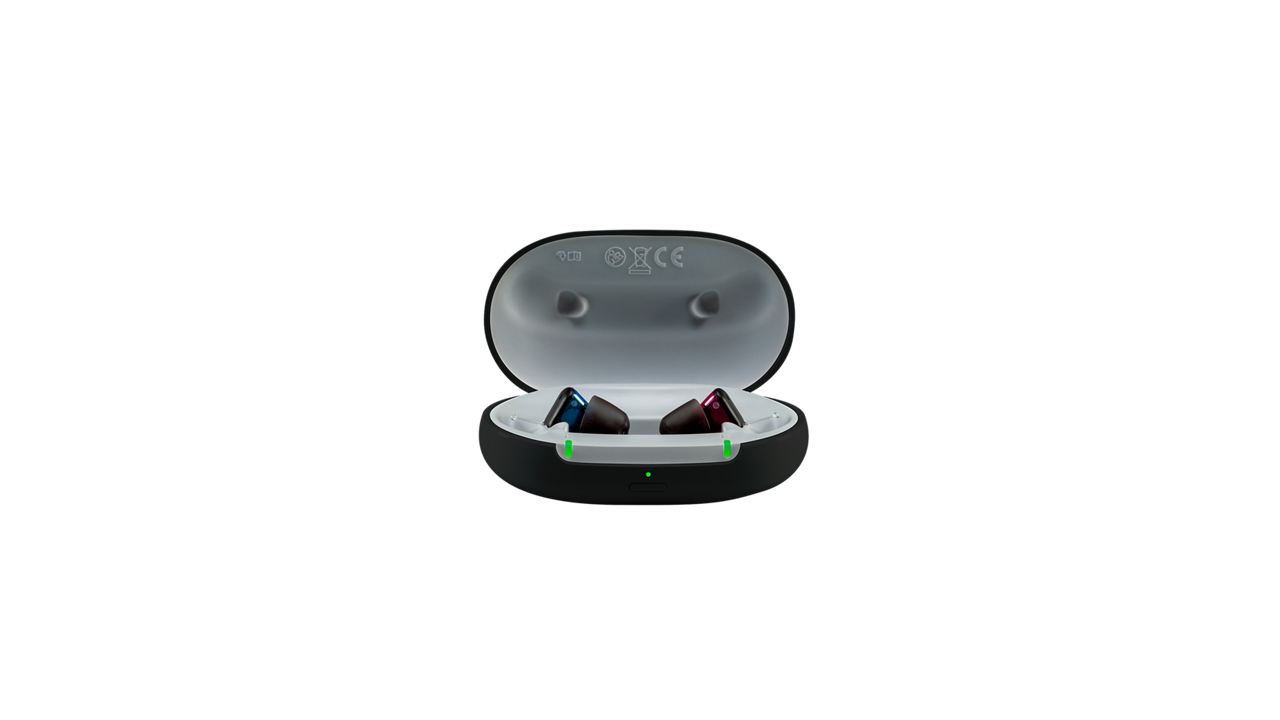 Wireless earbuds in open charging case