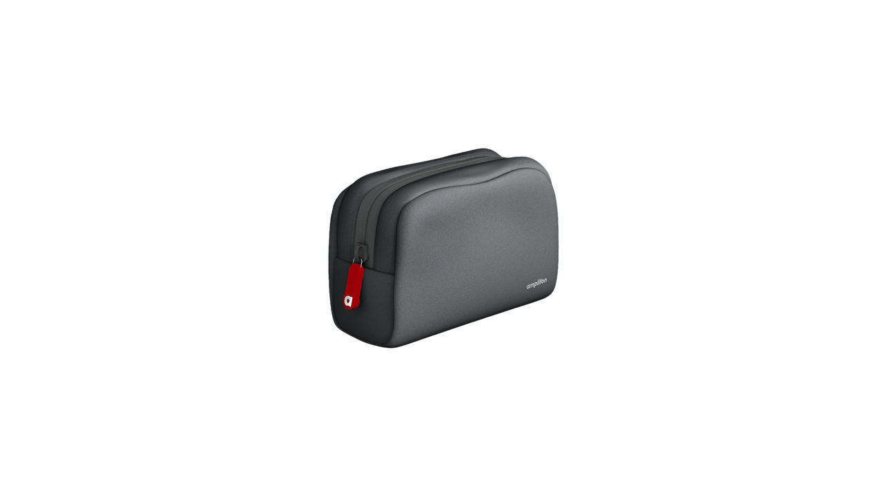 Black travel toiletry bag with red zipper pull