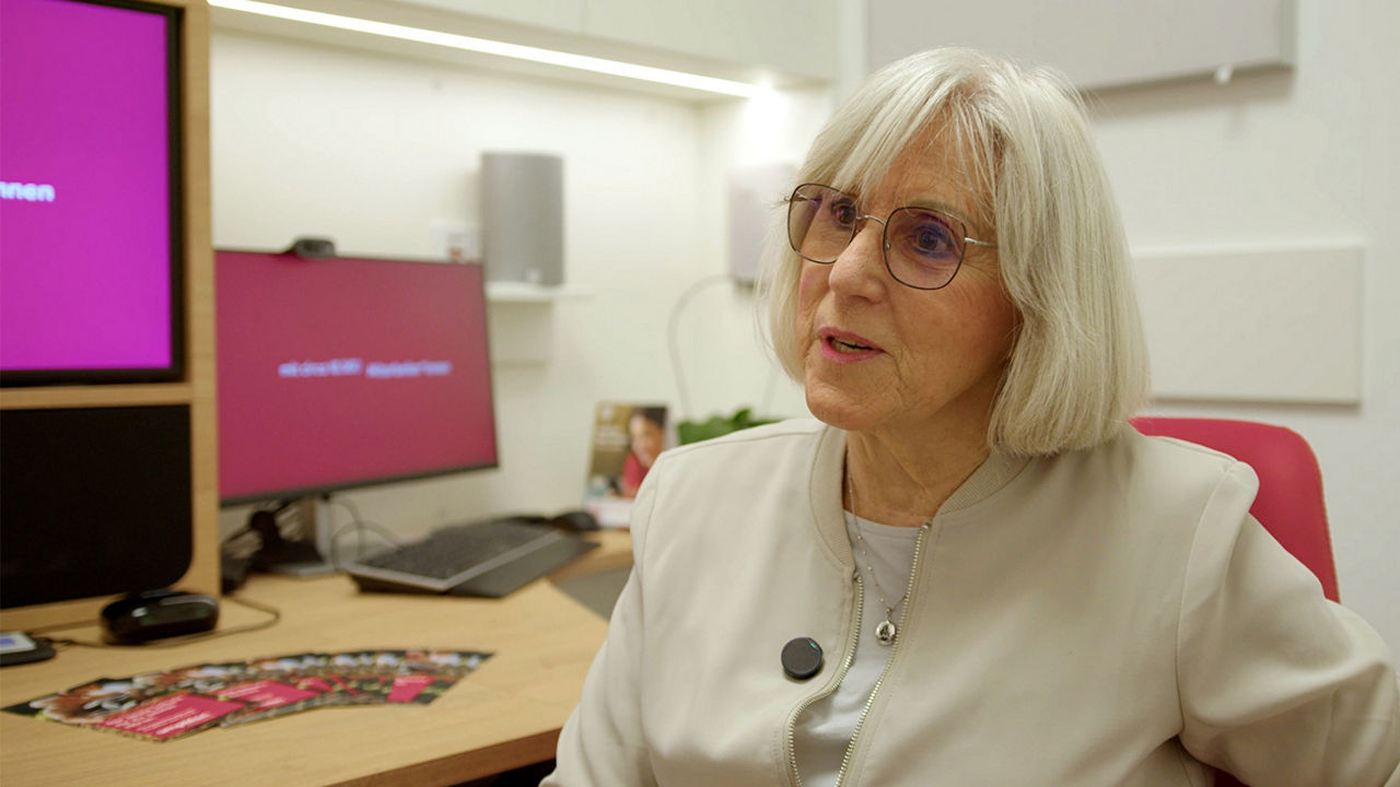 Senior woman speaking in modern office