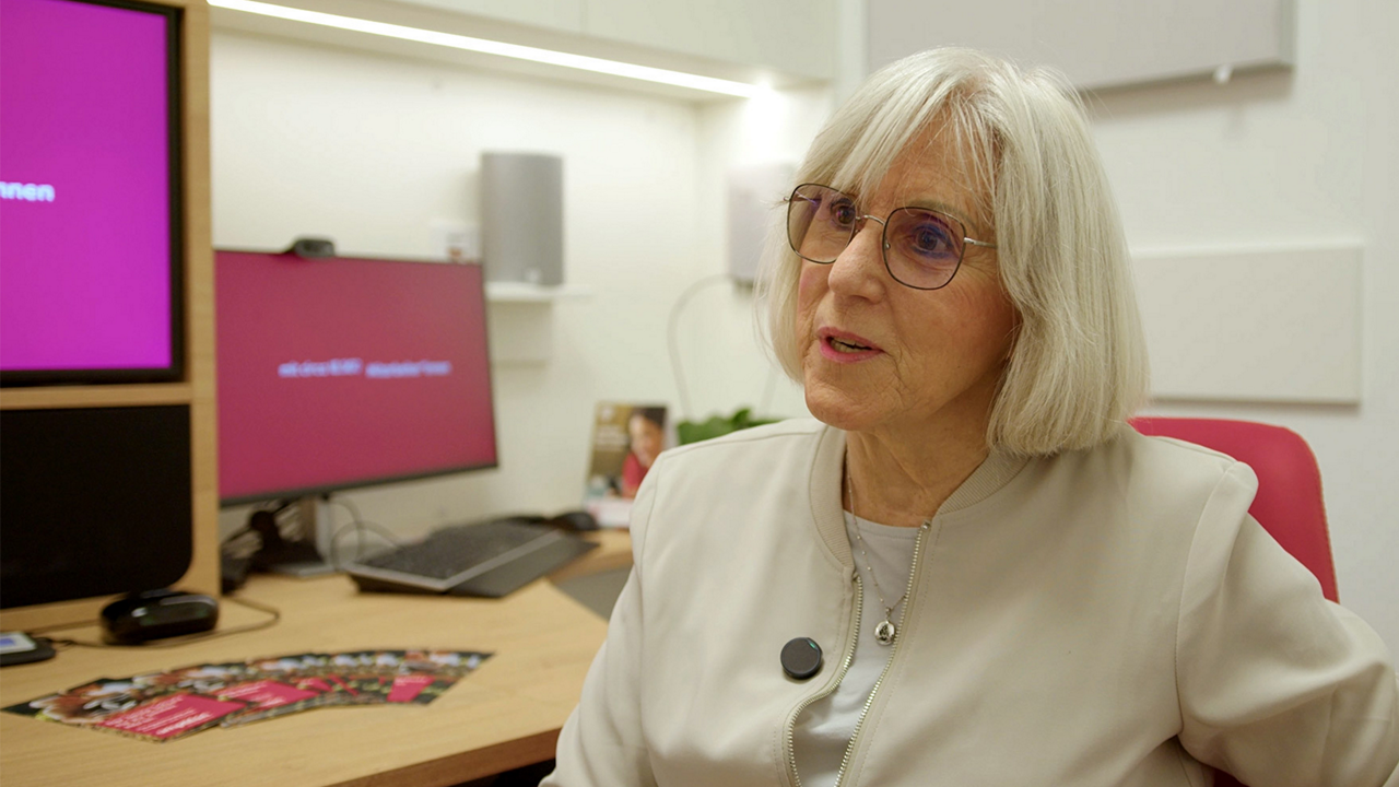 Senior woman speaking in modern office