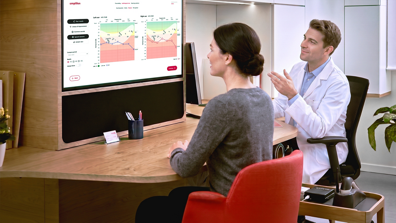 Doctor reviews health data with patient onscreen