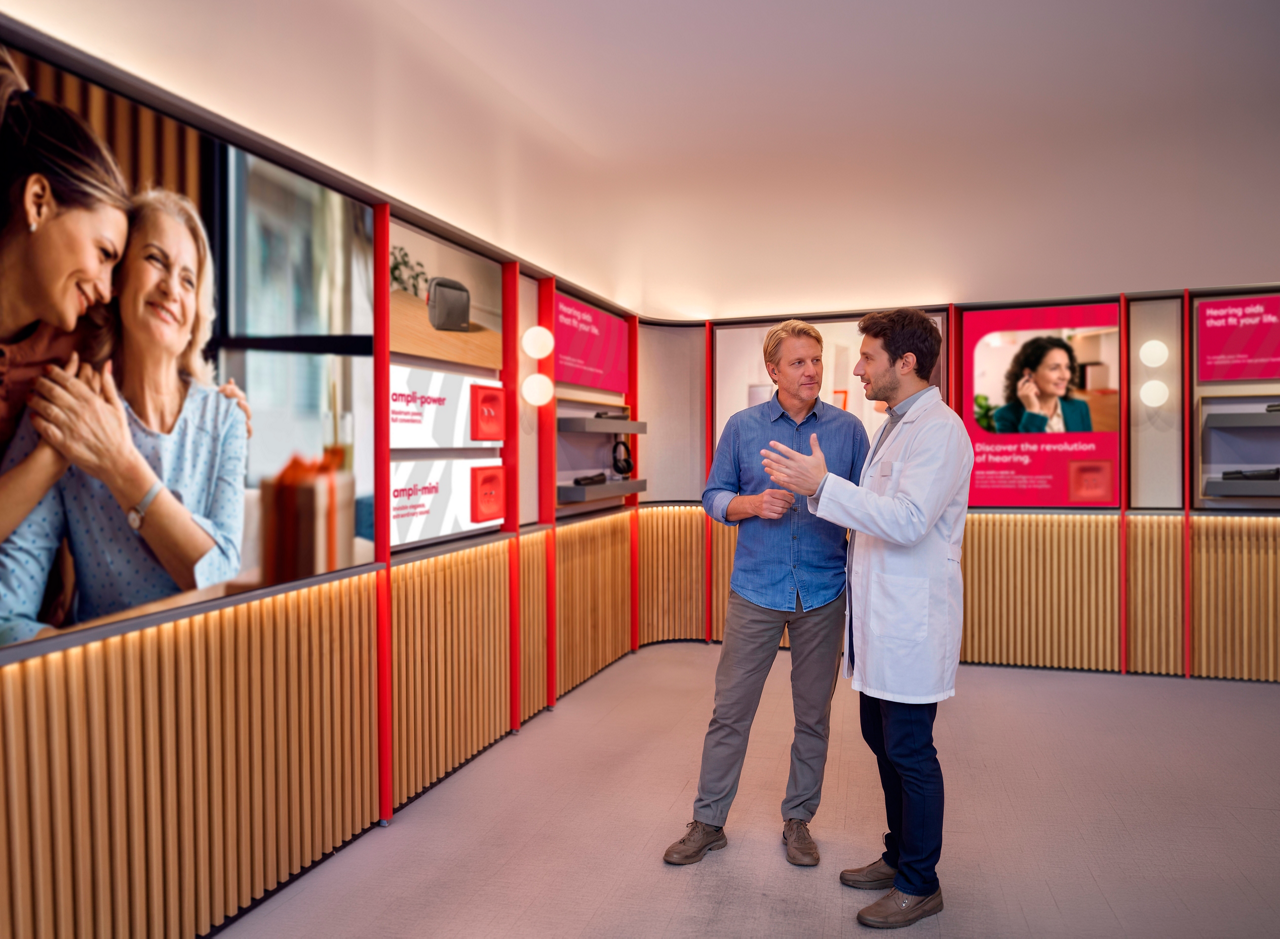 Customer consulting with professional in modern showroom