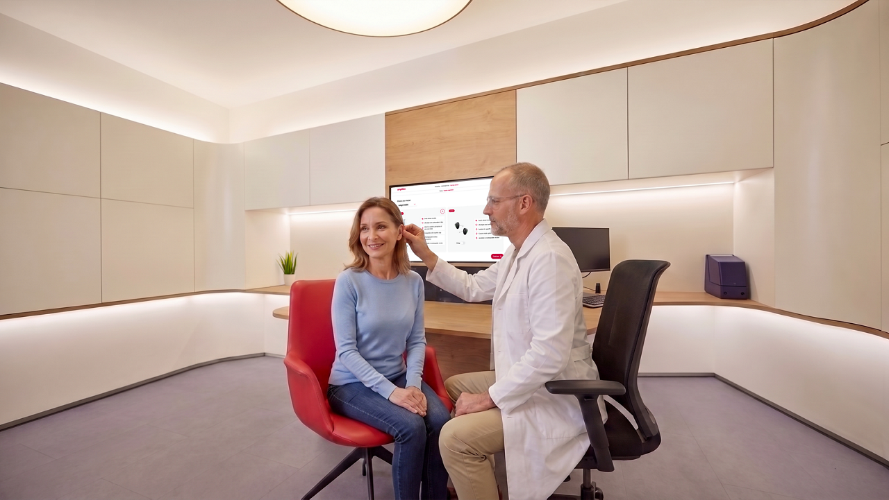 Doctor examining female patient in clinic office