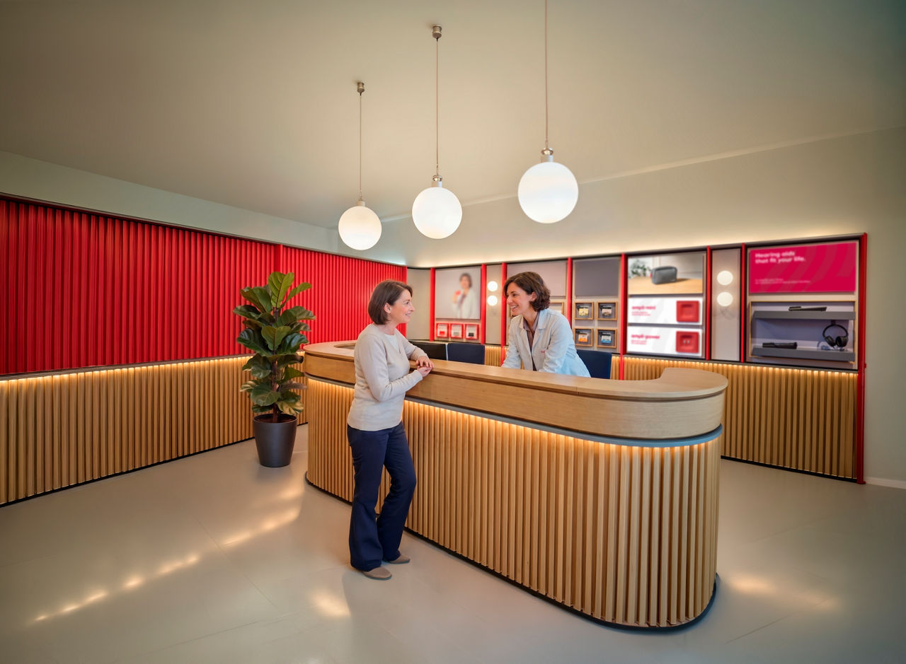 Modern reception desk with two women talking