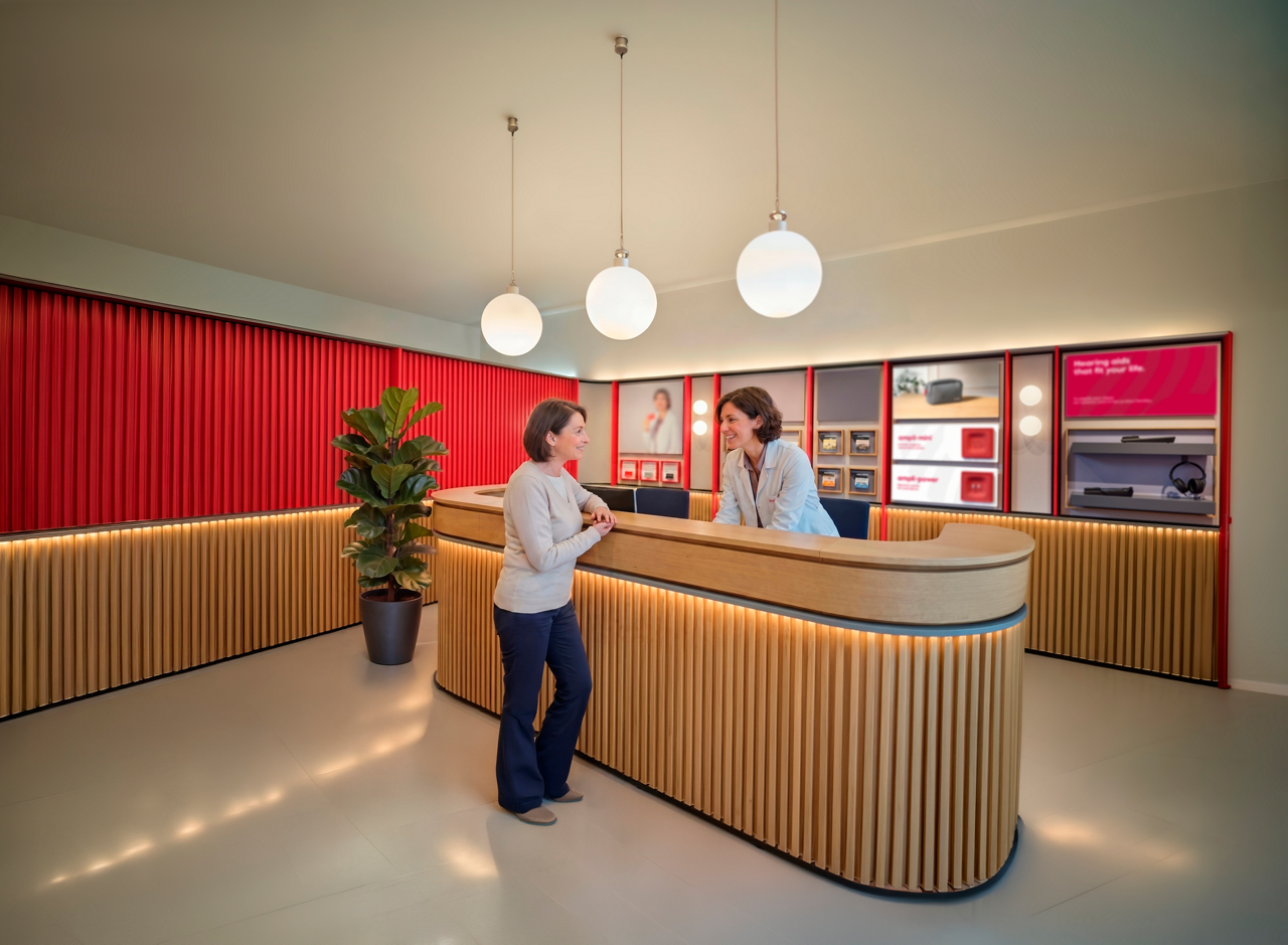 Modern reception desk with two women talking