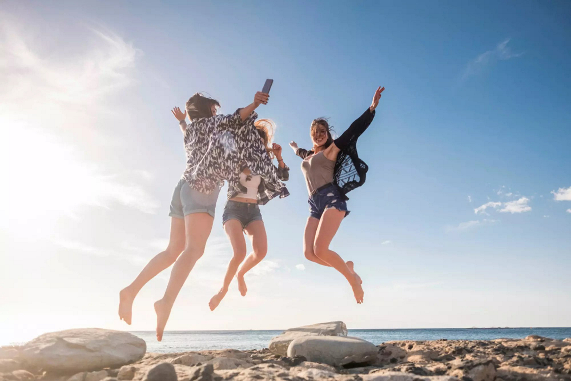 Three girlfriends celebrate Mexican Valentine's Day on the beach.