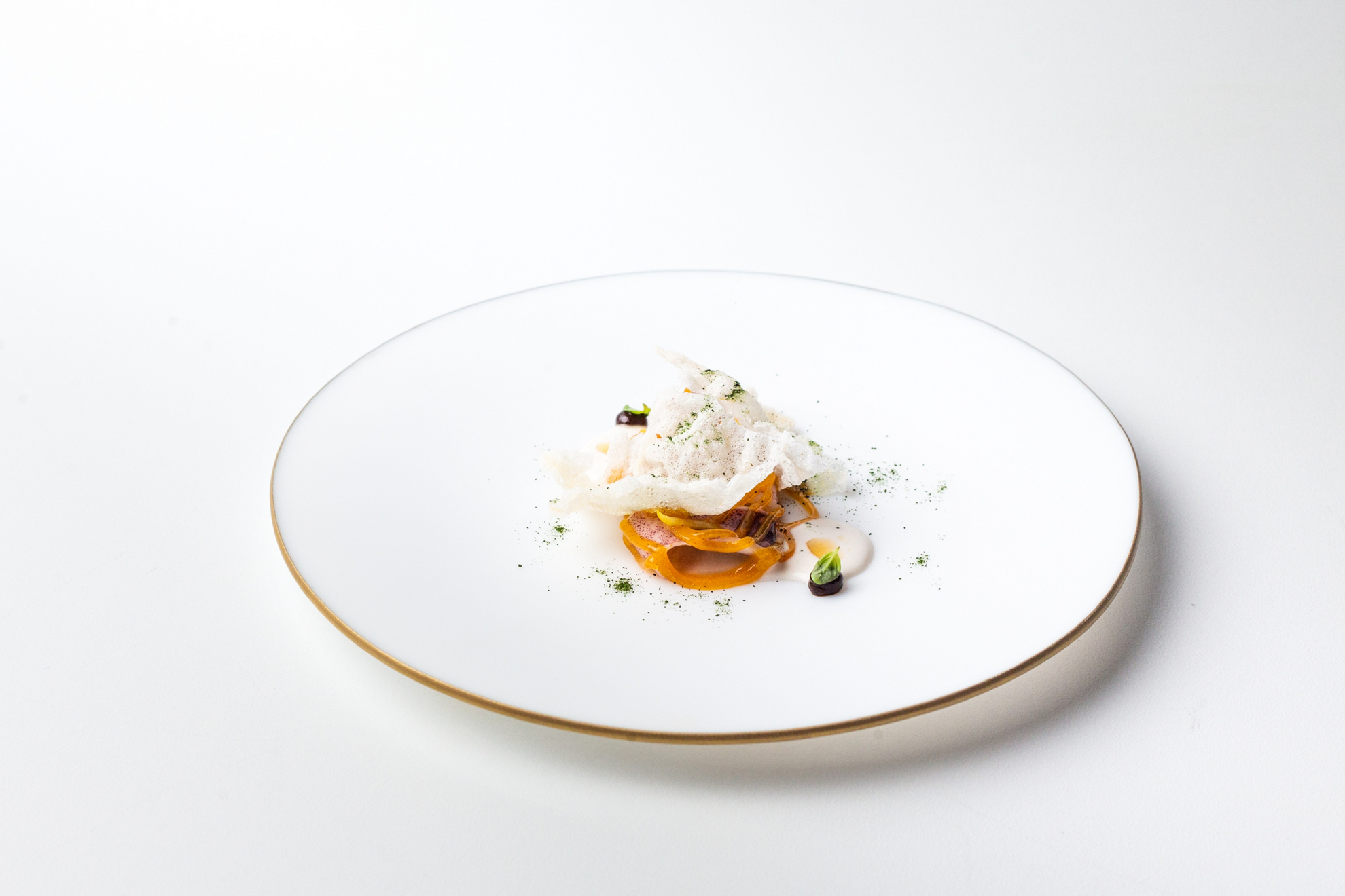 Baby squid, black garlic and lemon in brine