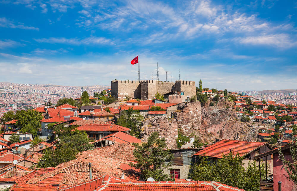 Ankara Castle: Views of the castle on top of a green hill overlooking red rooftops 