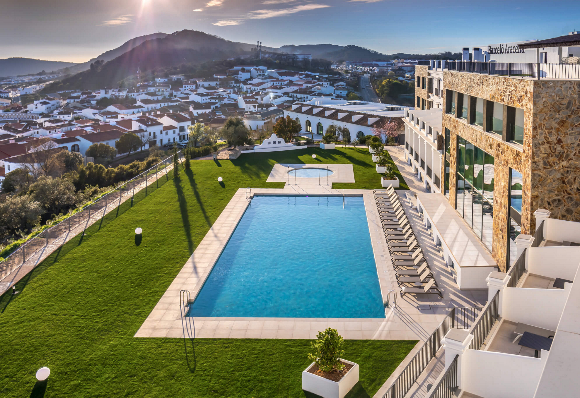 Best rural hotels in Spain: A view of the Barceló Aracena hotel & pool and the Sierra de Aracena