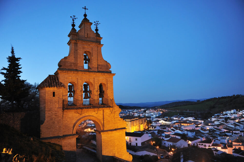 Aracena: A close-up of a church overlooking the old part of Aracena at night