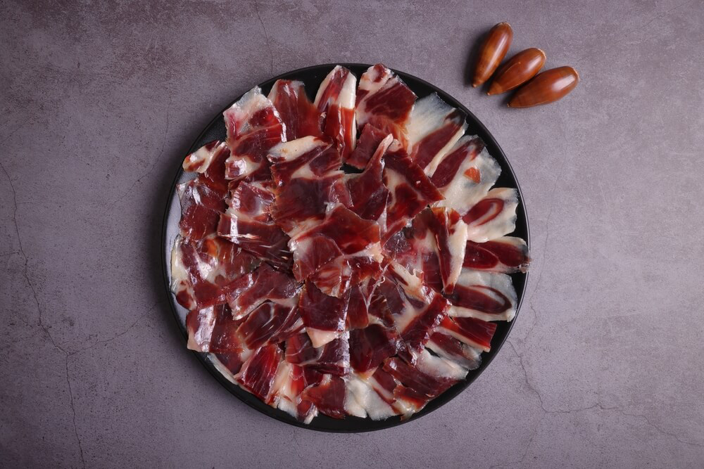 Jabugo Ham: A close-up of a place of Spanish Iberian ham with acorns