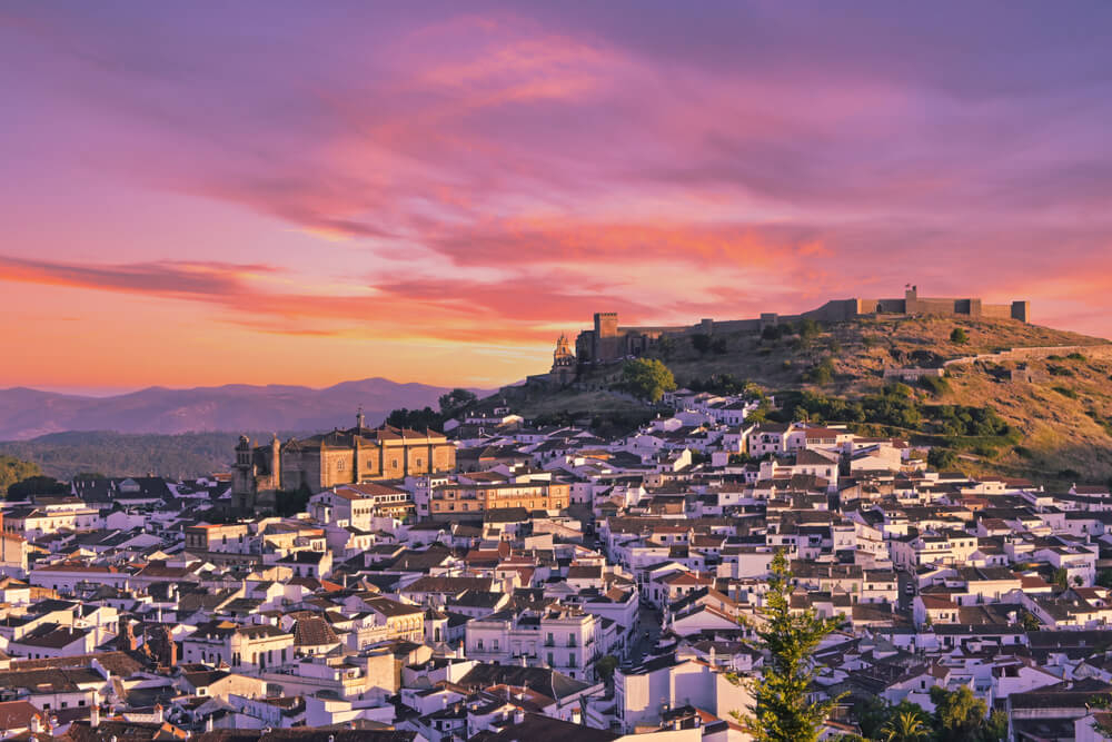 The town of Aracena from a distance at sunset