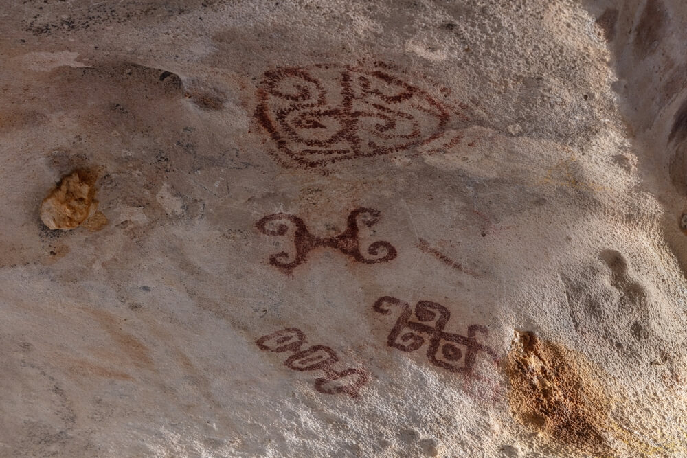 Cave painting depicting ancient Arawak drawings in Fontein Cave in Aruba.