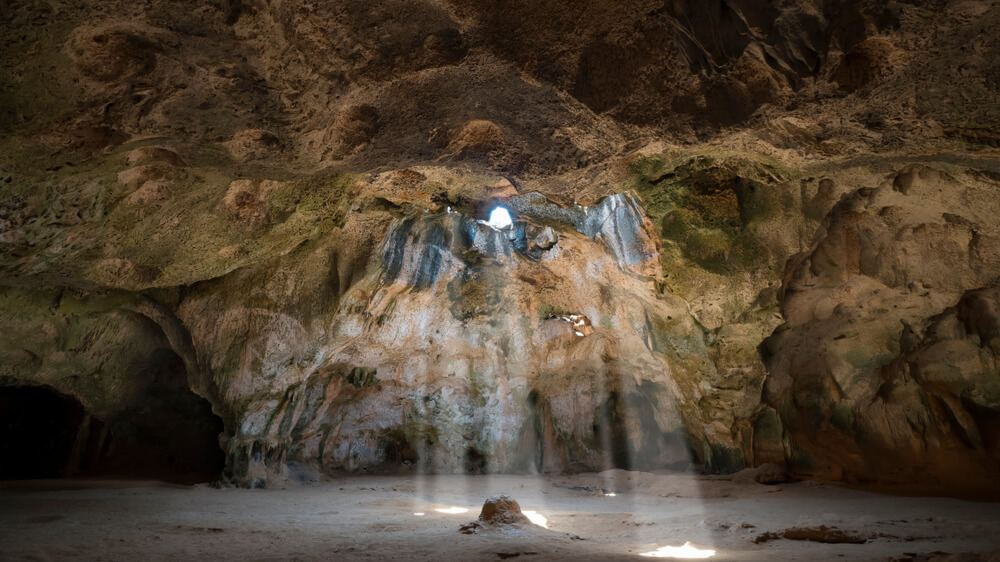 Exploring a cave is one of many great Aruba adventures you can partake in.