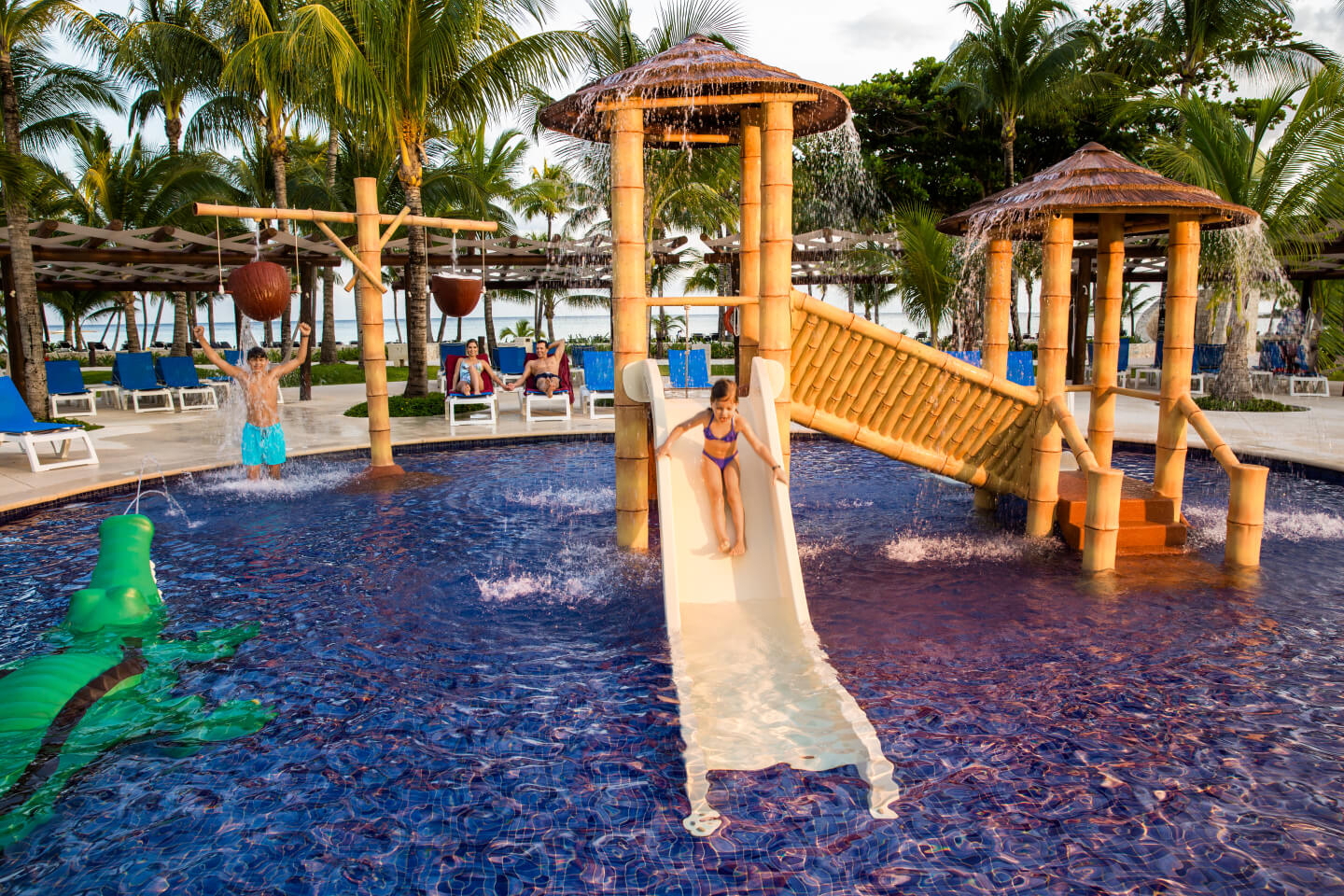 Kids play at a kids pool at Barceló Maya Beach hotel.